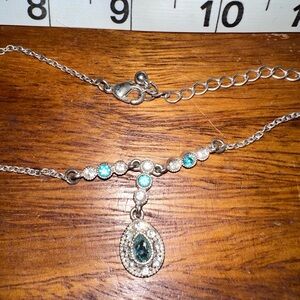 Silver, blue, and clear stone necklace